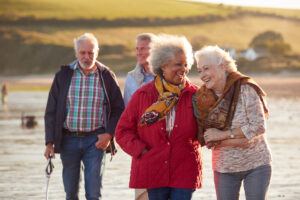 smiling senior friends on beach 1203192990 21Dec2020