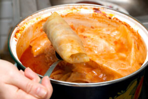 old-fashioned Eastern European cabbage rolls stuffed with beef in a pot on the stove