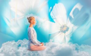 A blond woman is sitting calmly on fantasy white puffy clouds with eyes closed in meditation and large semi-transparent white flowers float in a fantasy blue sky behind her.